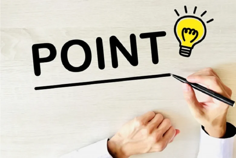 机にポイントの文字を書く手